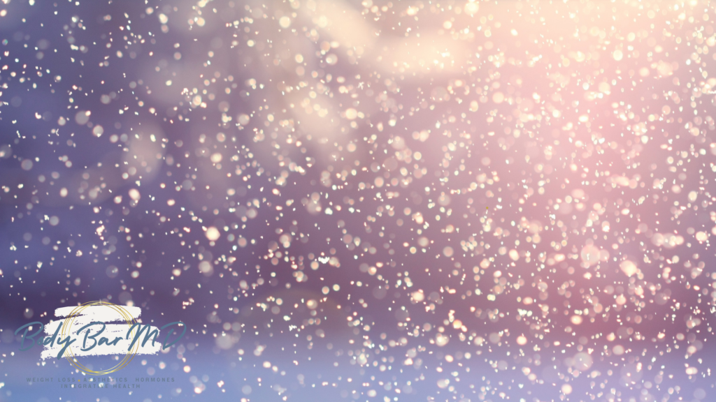 Soft pastel snowfall against a dreamy background, with the Body Bar MD logo in the lower left corner.