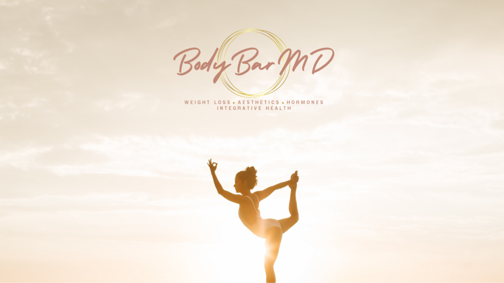 Silhouette of a woman performing a yoga pose at sunrise, with the Body Bar MD logo. This image symbolizes balance, wellness, and holistic health.