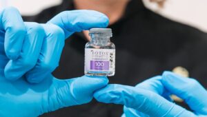 A provider holds up a vial of Botox in Carmel, IN