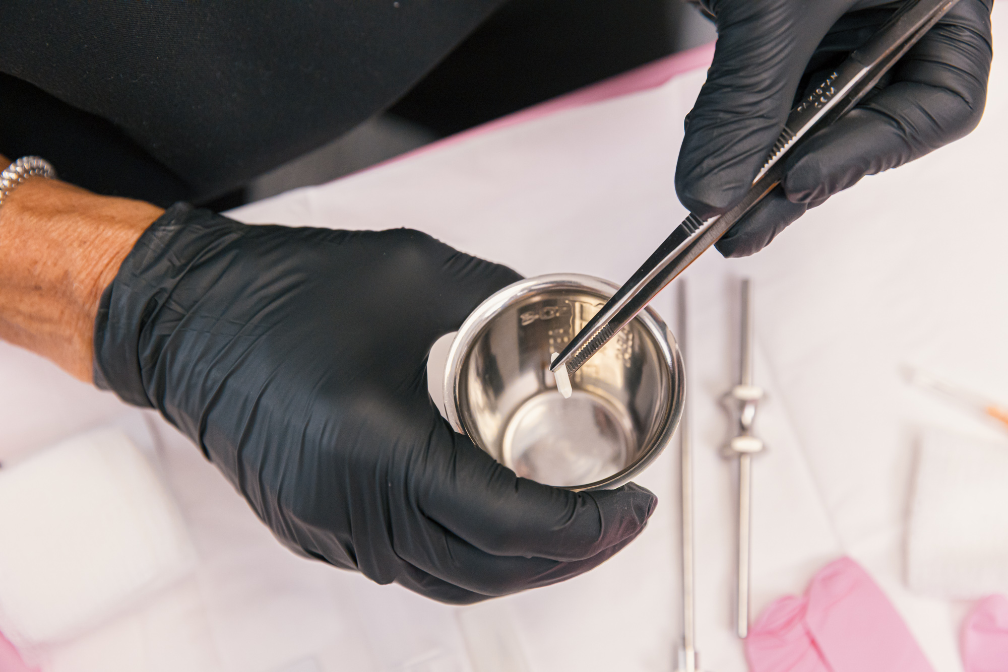 A gloved provide prepares pellet hormone replacement therapy for perimenopause in Carmel, IN