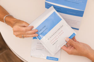 A patient learns how to maintain their weight loss results following a treatment for skin tightening after weight loss in Carmel, IN