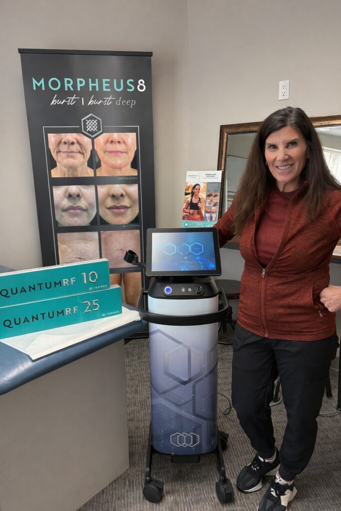 A provider stands in front of the QuantumRF for skin tightening after weight loss in Carmel, IN.